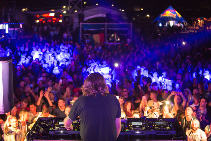 DJ Playing in a Club with huge audience