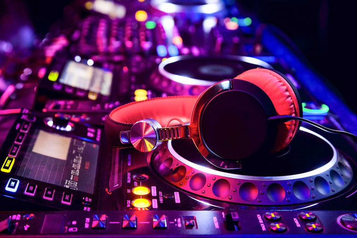 DJ Controller and headphones in a club